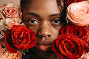 a close up of a person surrounded by flowers