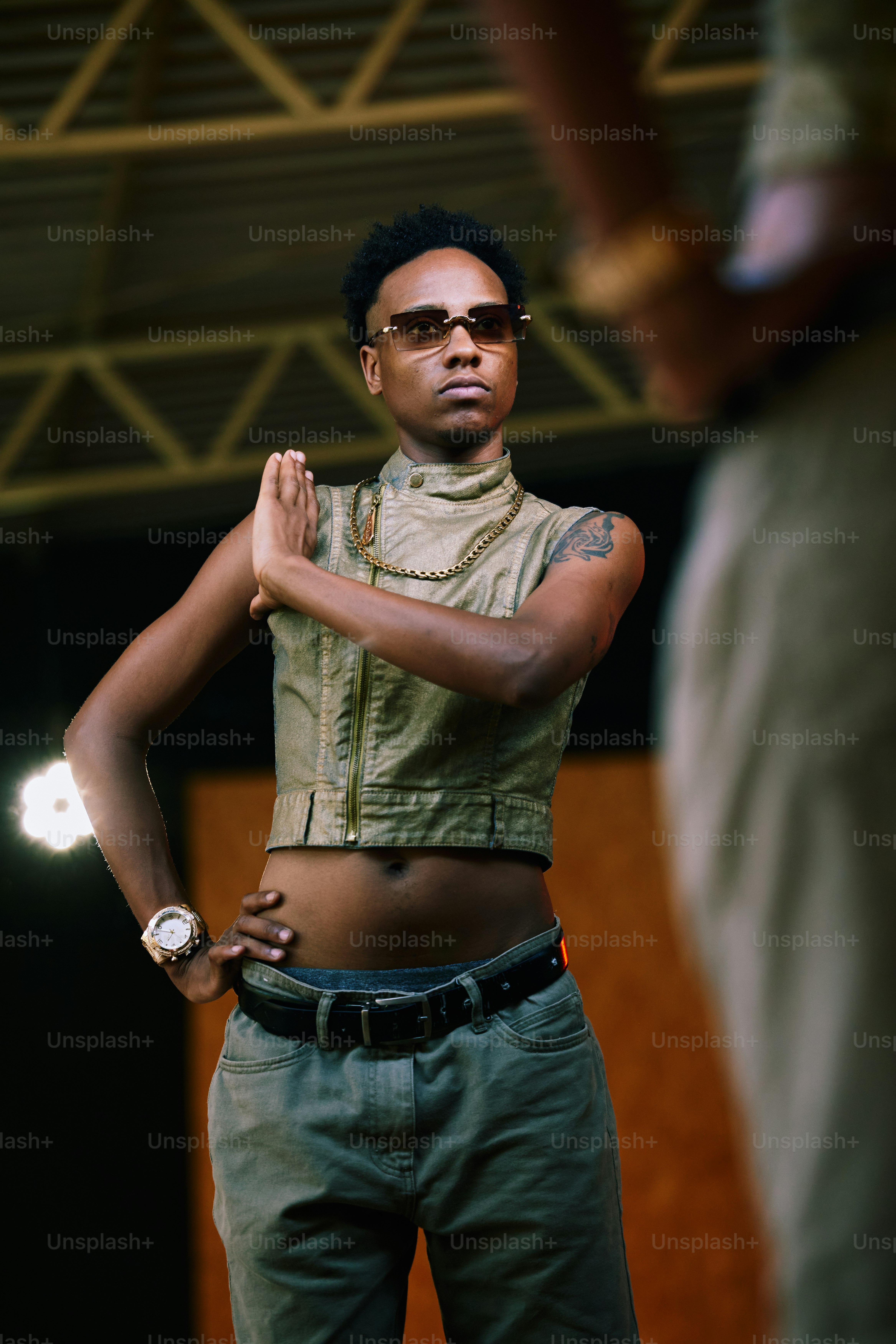 a woman standing in front of a camera