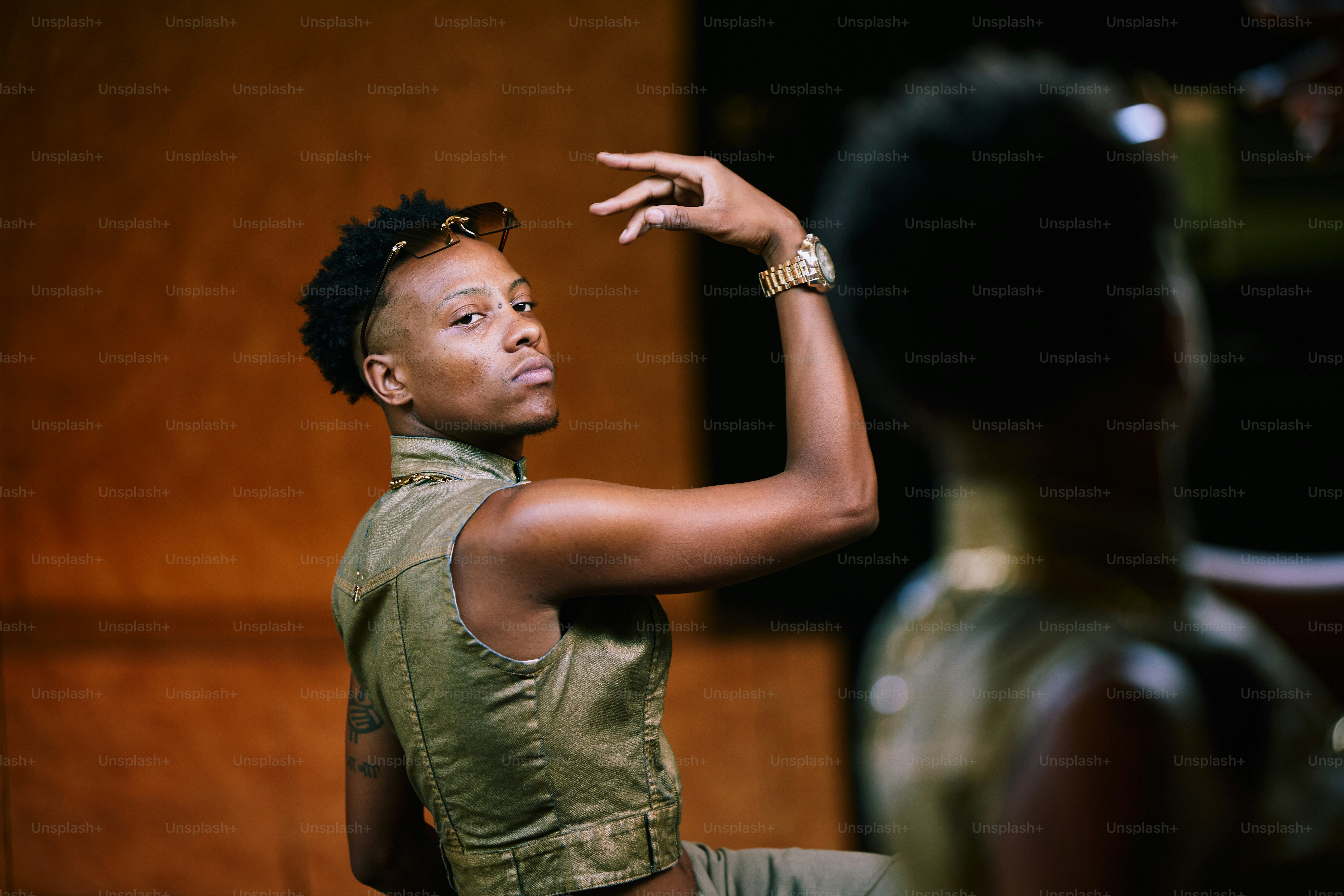 a woman in a green top is pointing at something