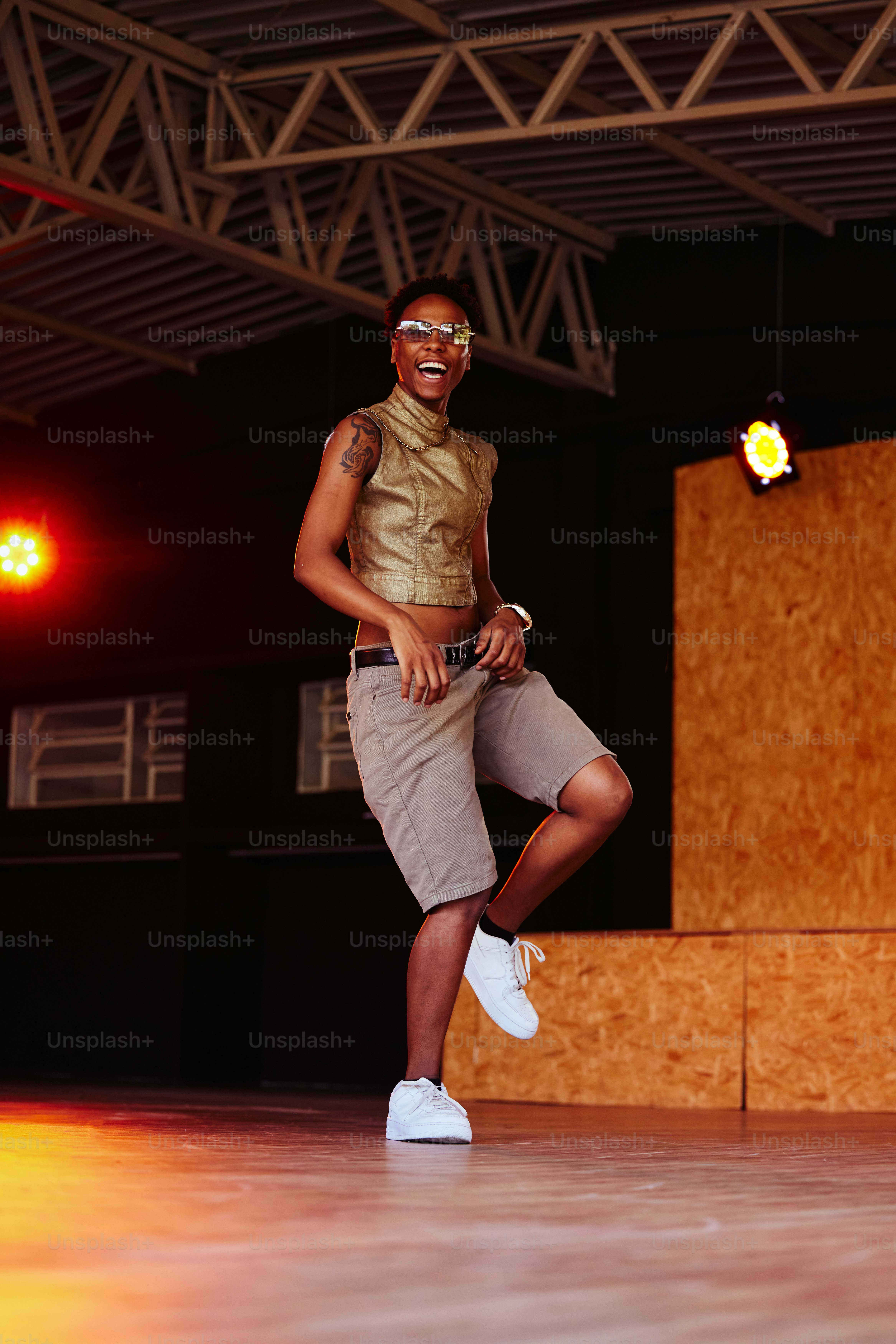 a man standing on a stage with a smile on his face