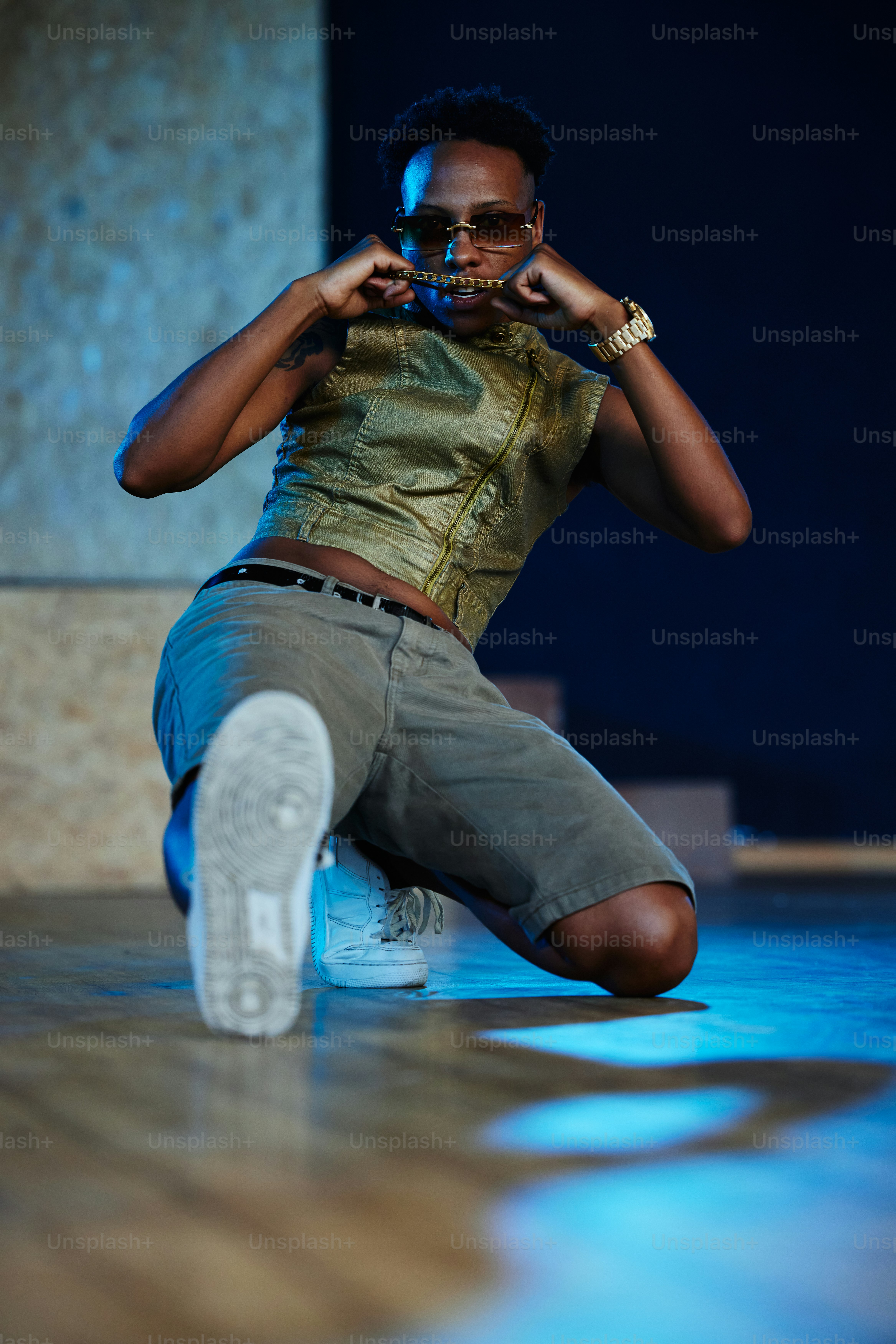 a man sitting on the floor taking a picture