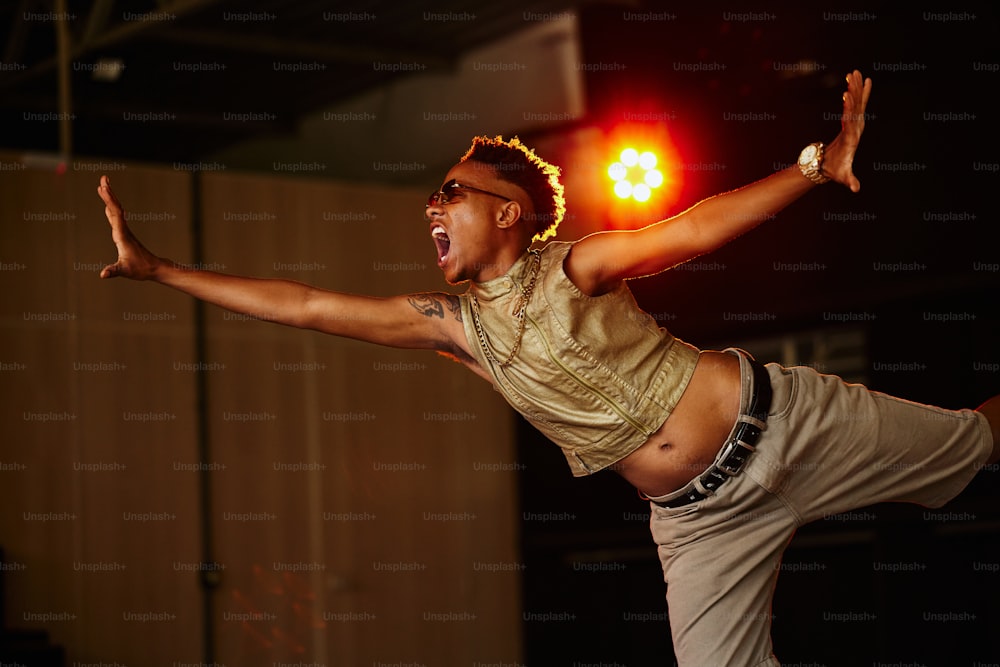 a man is jumping in the air with a tennis racket