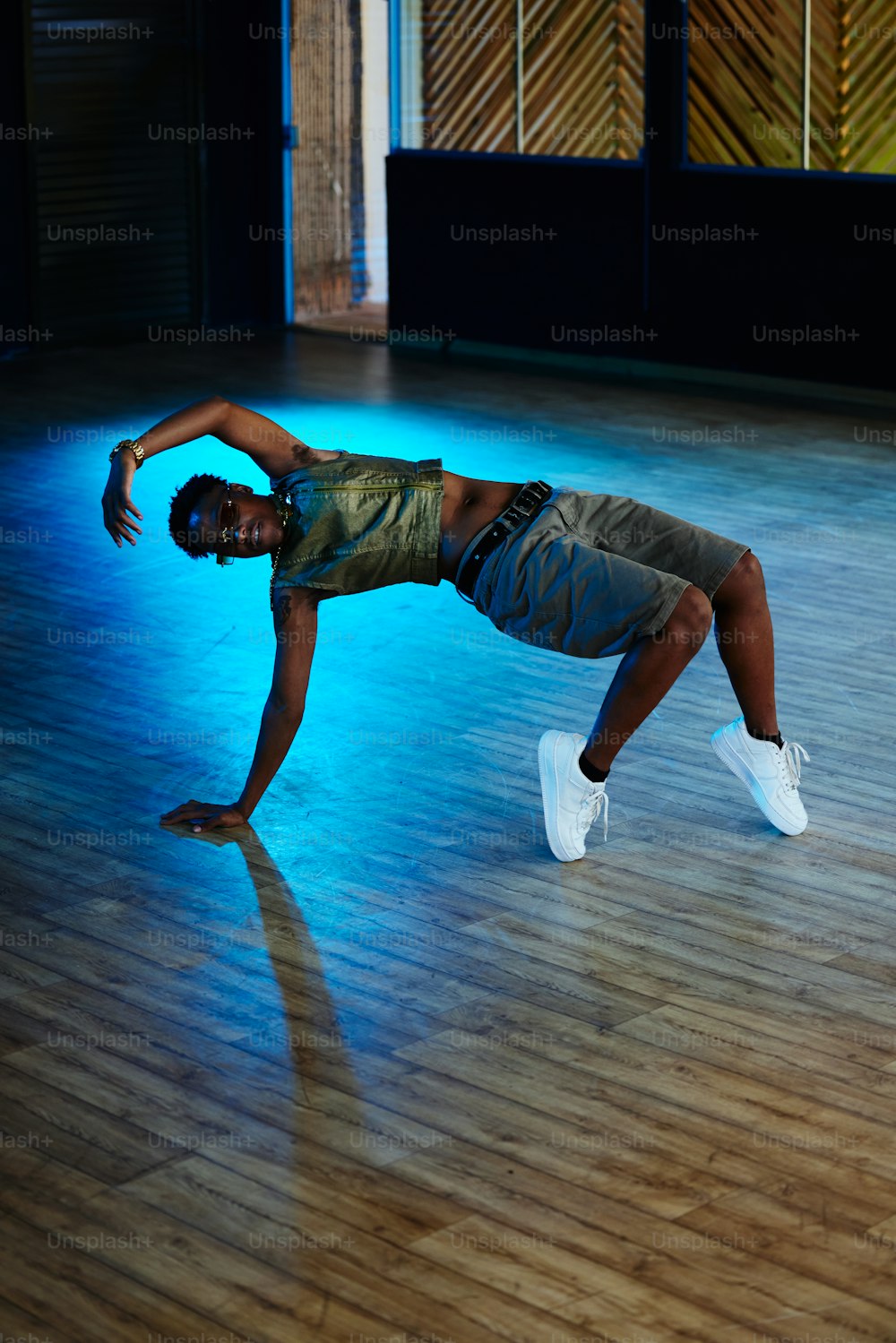 a man standing on one leg in a dance pose