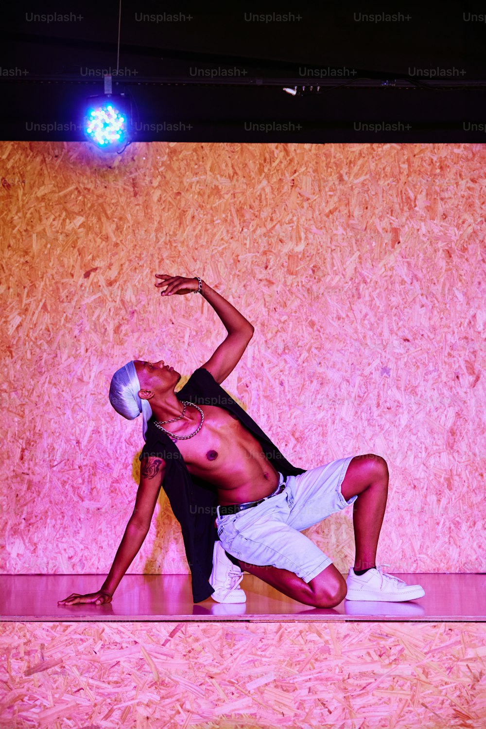 a man doing a handstand on a stage