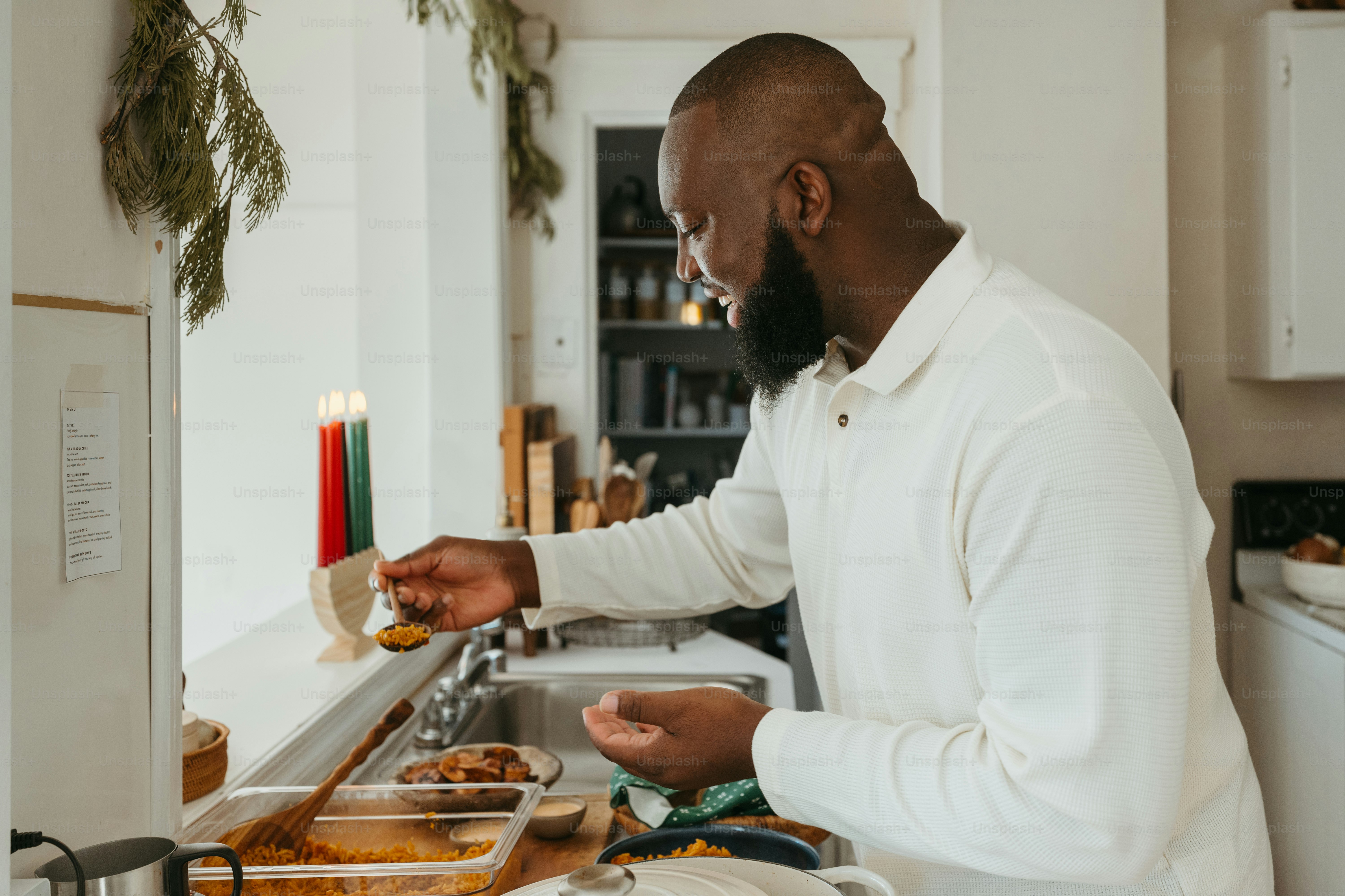 a man standing in a kitchen preparing food