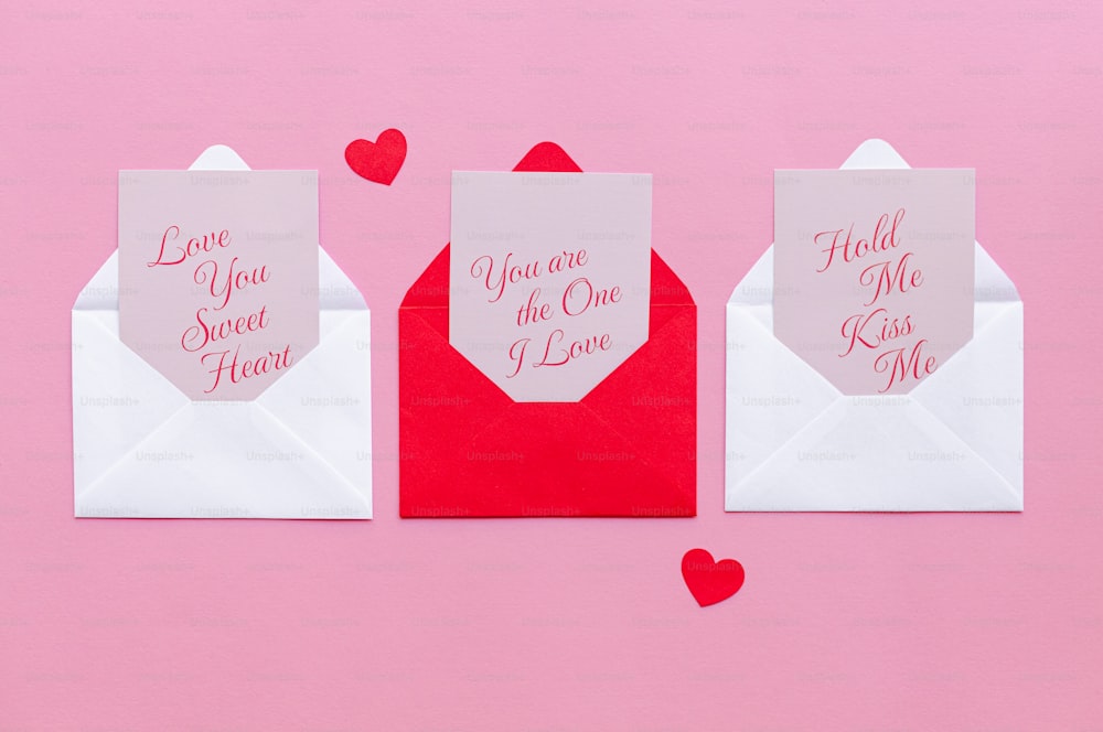 a couple of envelopes that have hearts on them