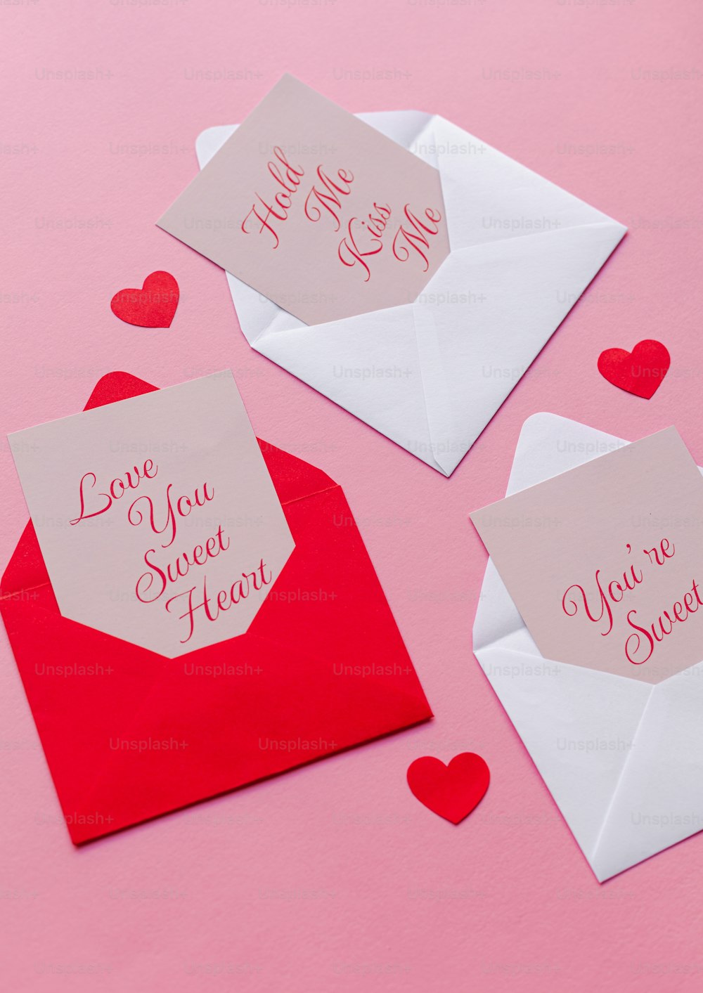 a couple of envelopes that have hearts on them
