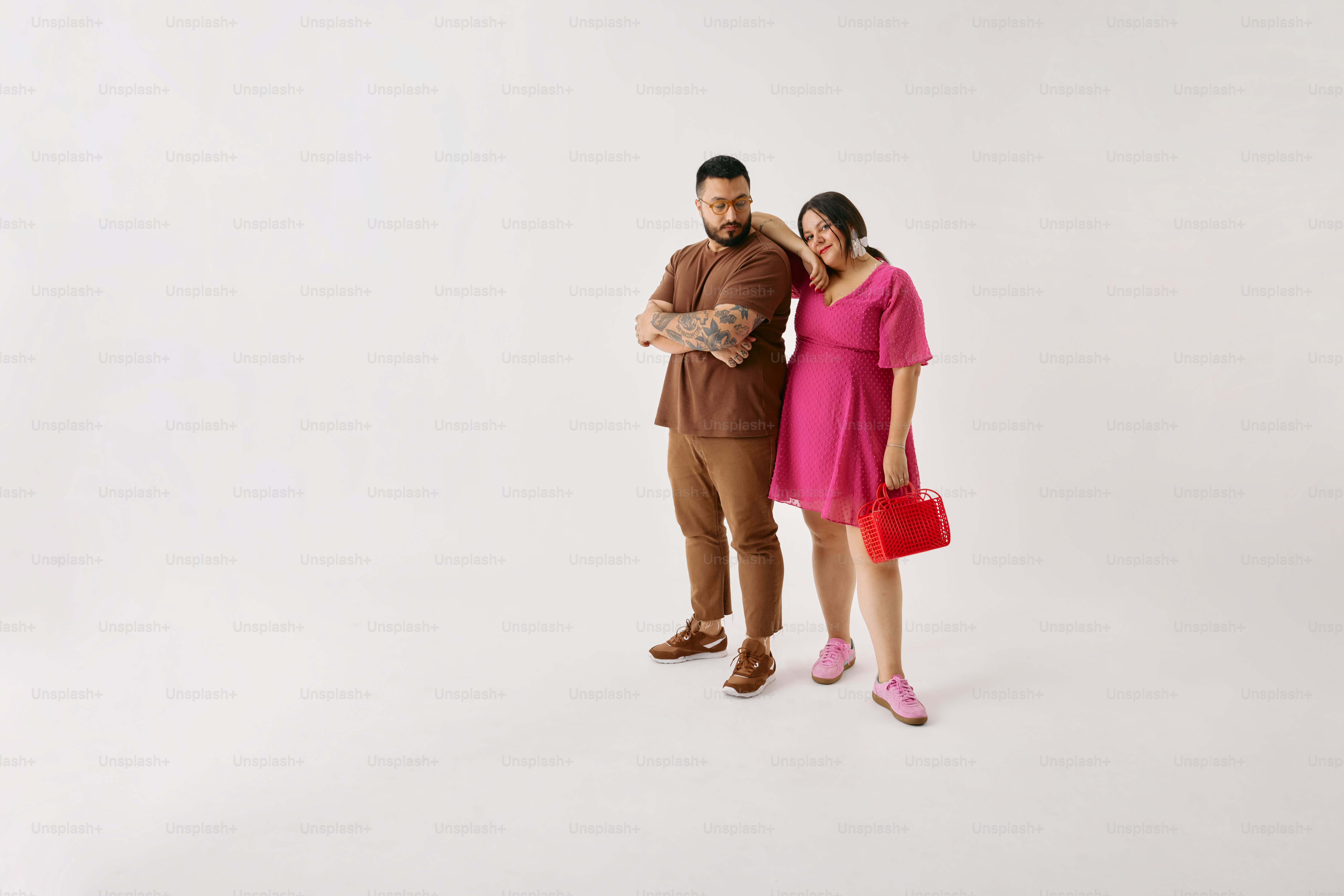 A man and a woman standing next to each other photo – Woman Image on ...