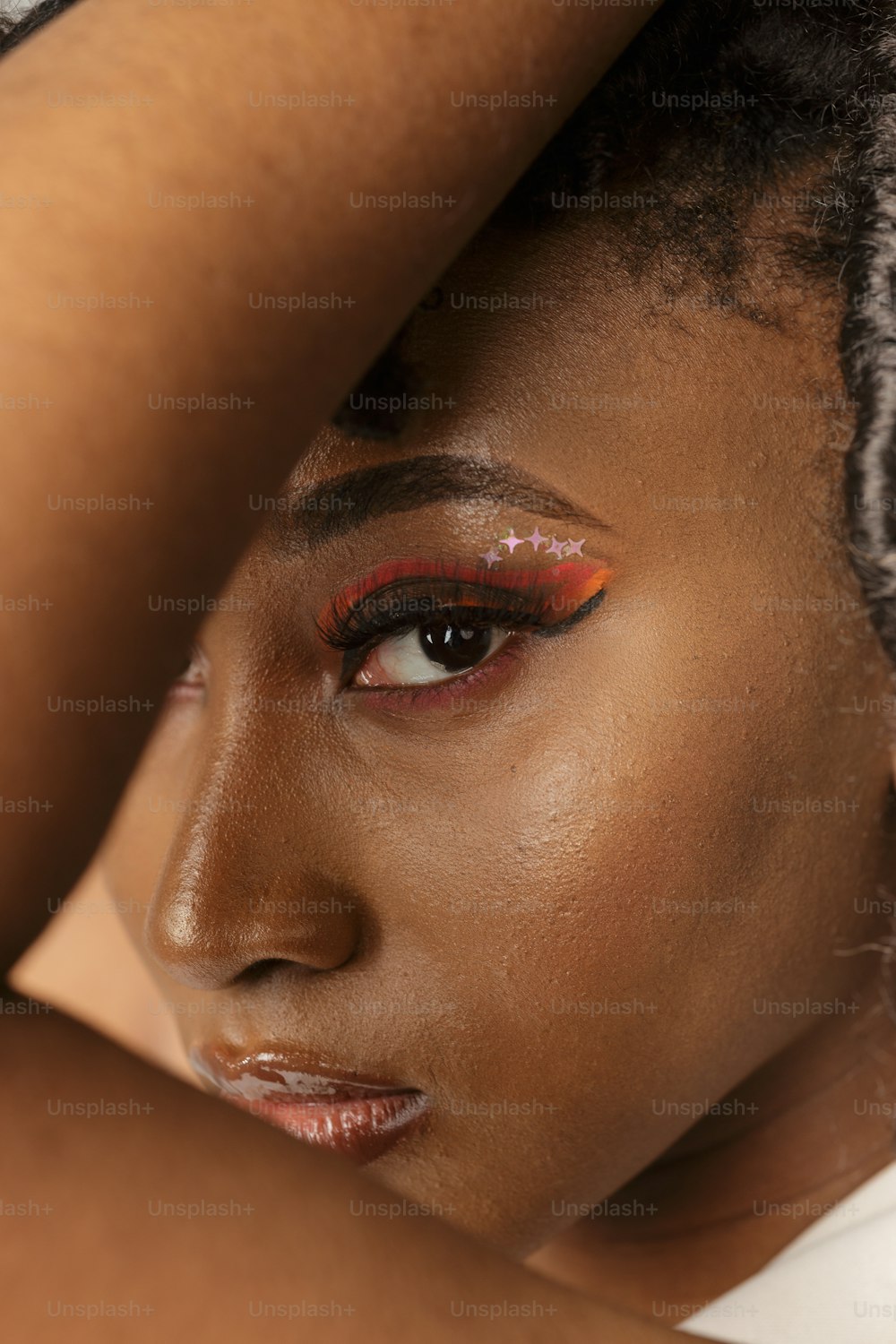 a close up of a woman with red makeup