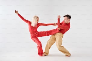 a man and a woman doing a dance move