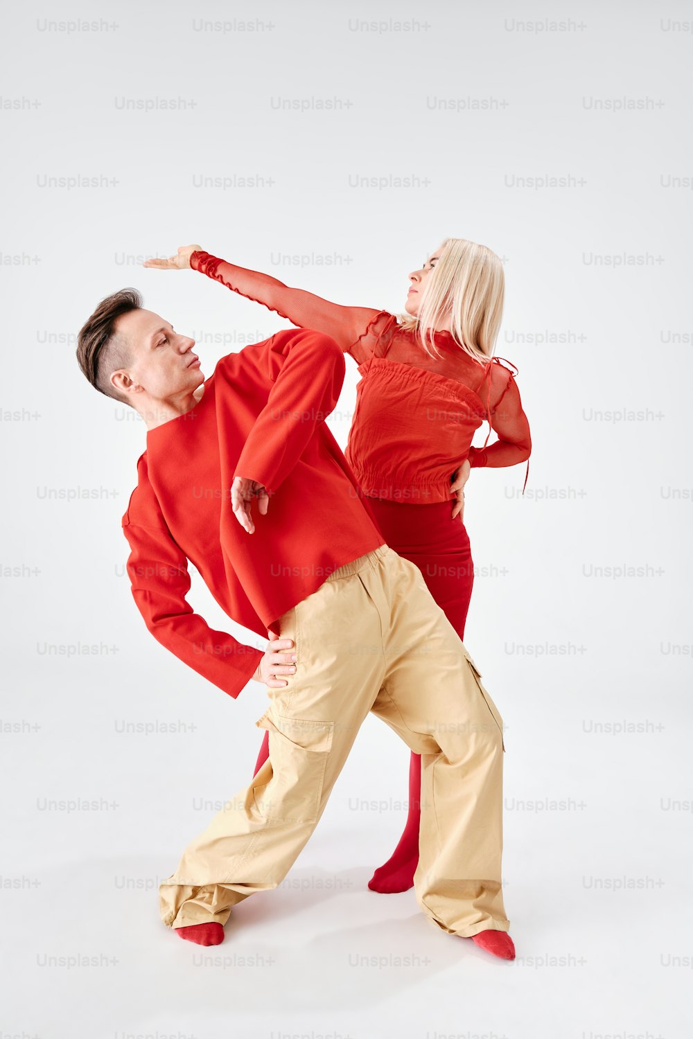 a man and a woman are dancing together