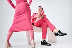 a woman in a pink suit and a woman in a pink dress