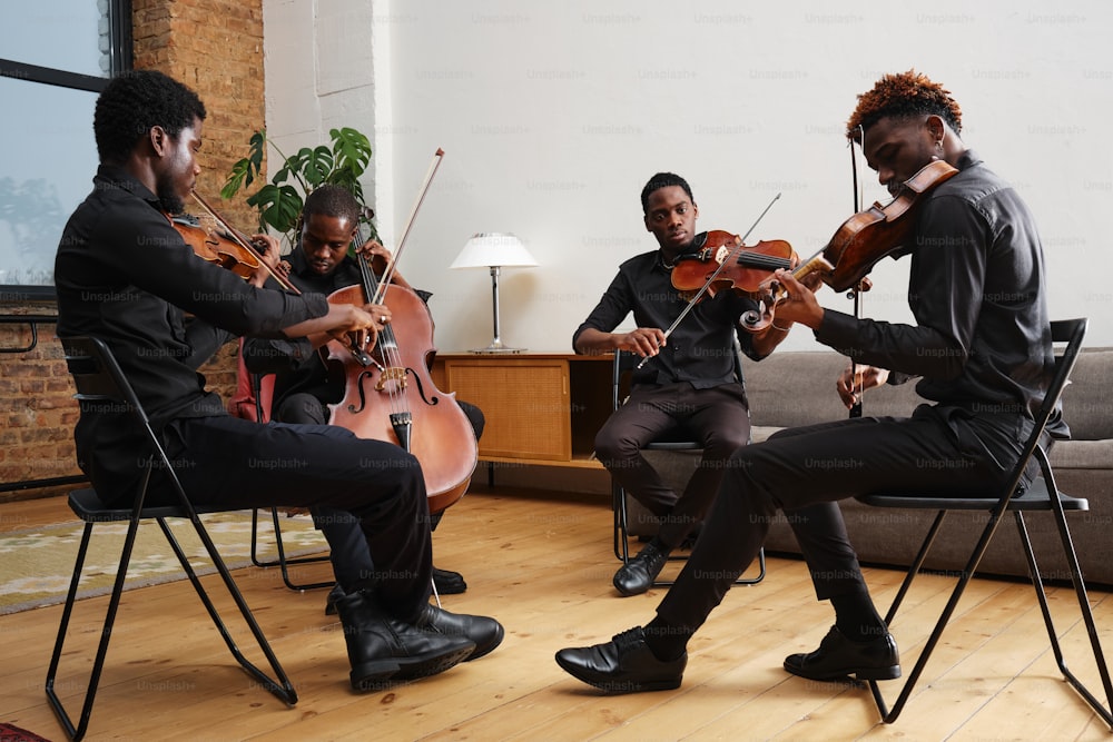 a group of men playing instruments in a living room