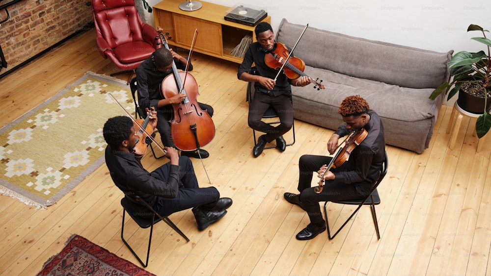 a group of people playing instruments in a living room