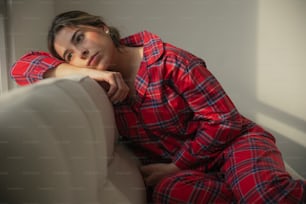 a woman in a red and blue plaid pajamas