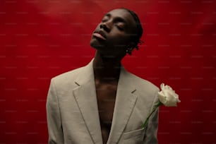 a man in a suit with a flower in his lapel