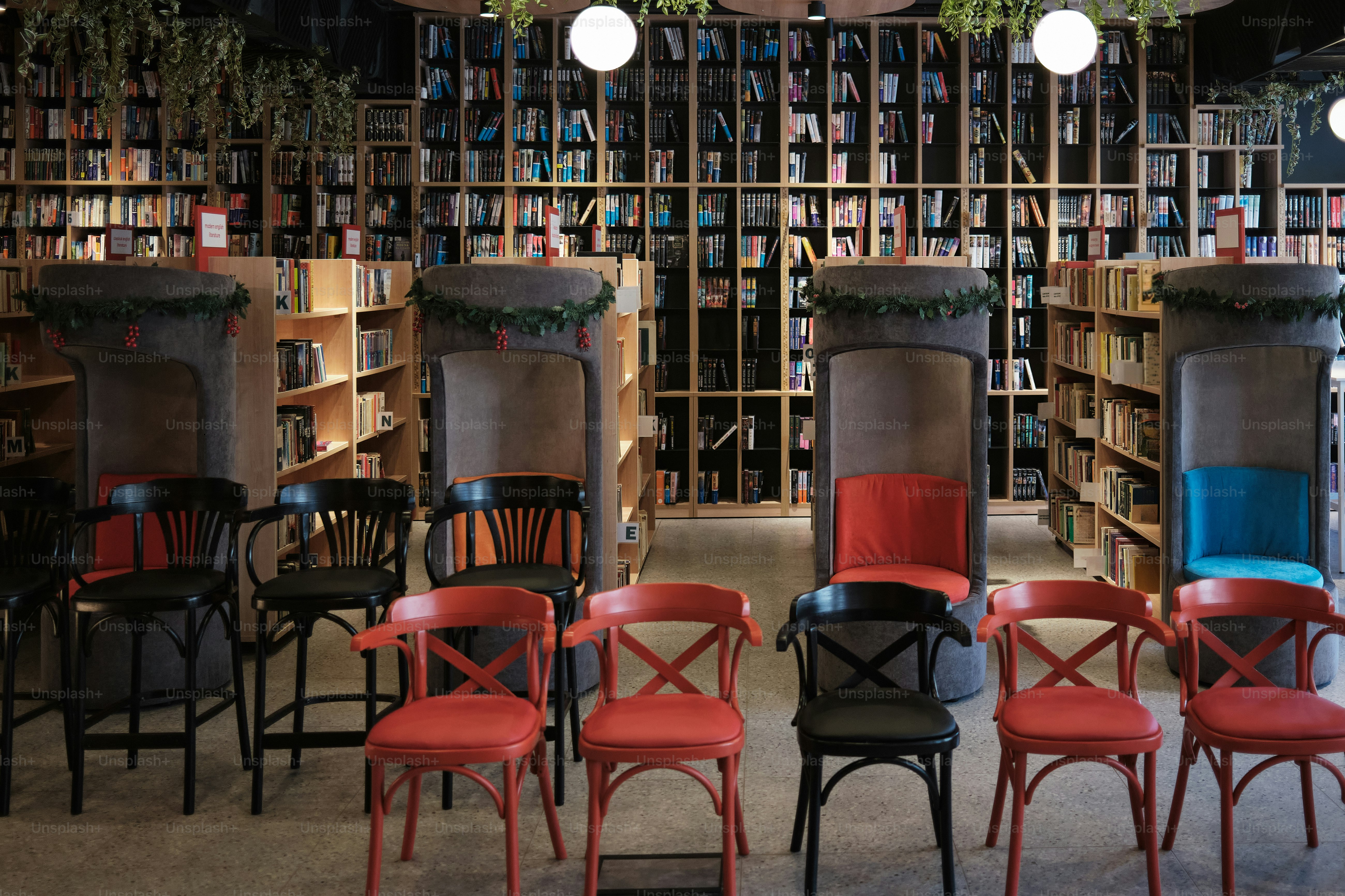 Chairs arranged in front of bookshelves in a cozy cafe.