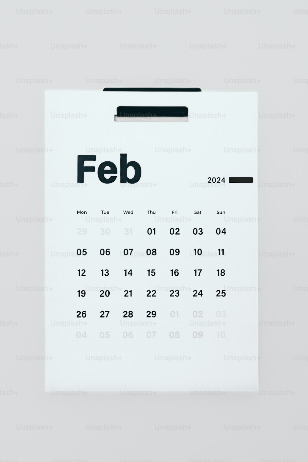 a white calendar with the word feb on it