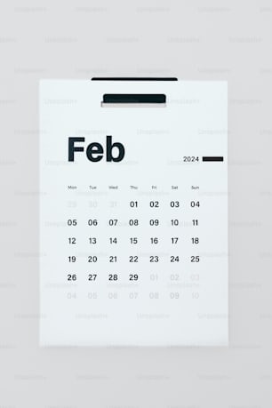 a white calendar with the word feb on it