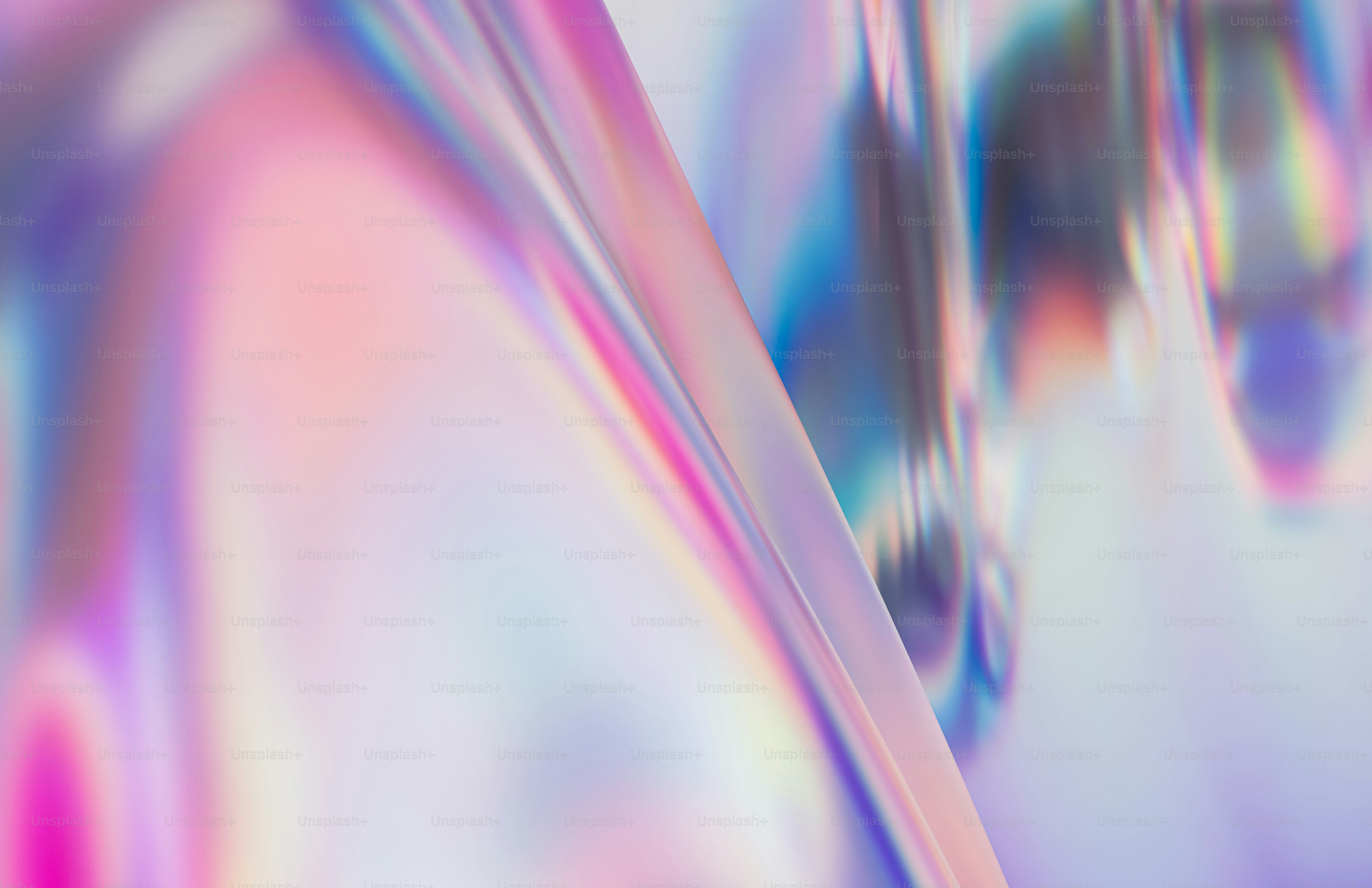 Ein verschwommenes Bild mit einem rosa und blauen Hintergrund