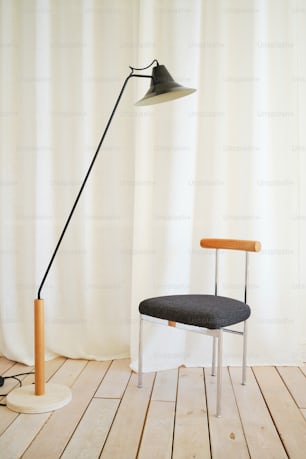 a chair and a lamp on a wooden floor