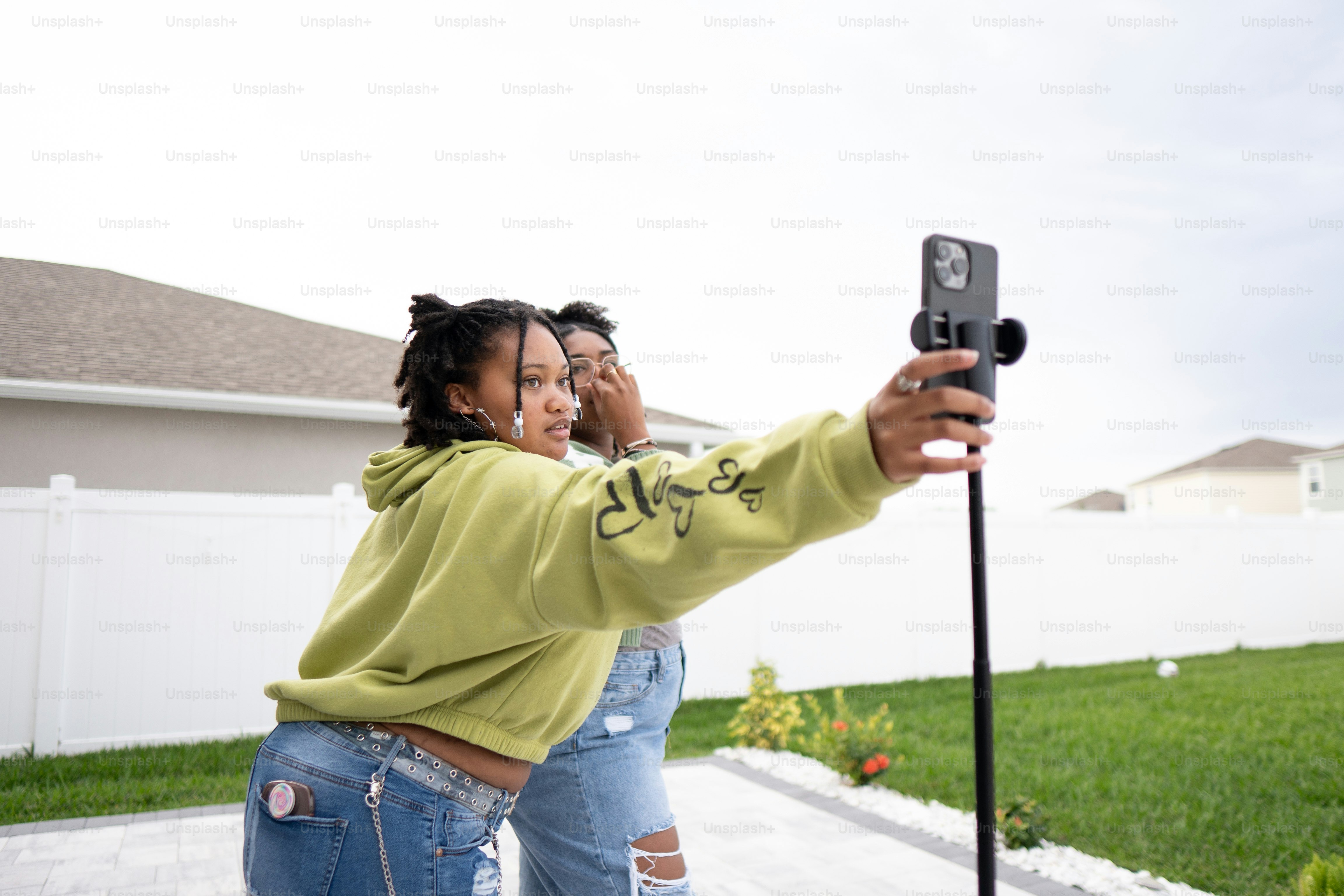 a woman taking a picture with her cell phone