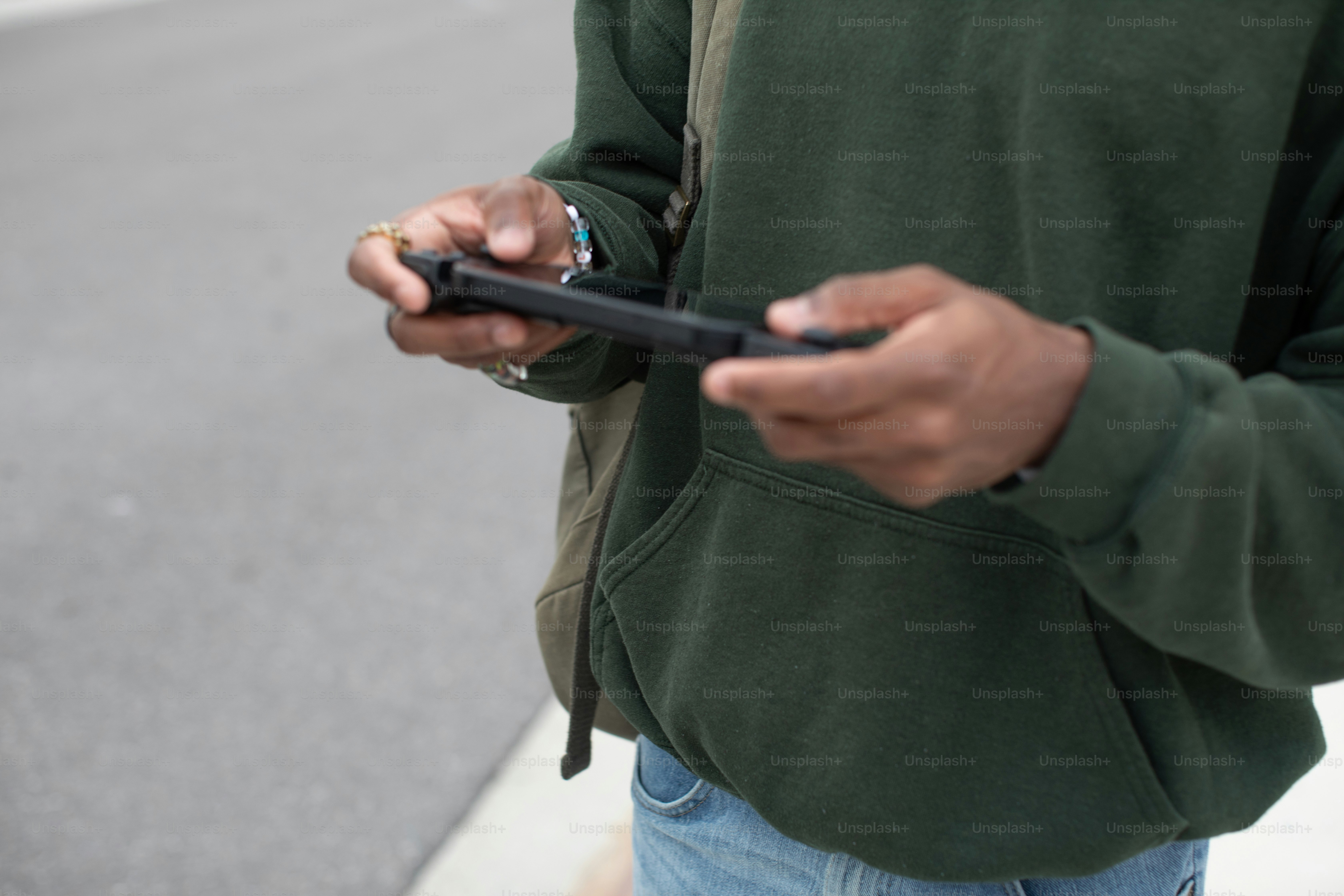 a man holding a cell phone in his hands