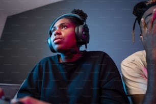 a man and a woman wearing headphones in a room