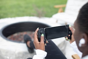 a woman taking a picture with her cell phone