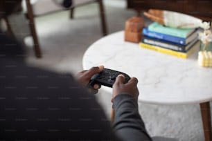 a person holding a remote control in their hand
