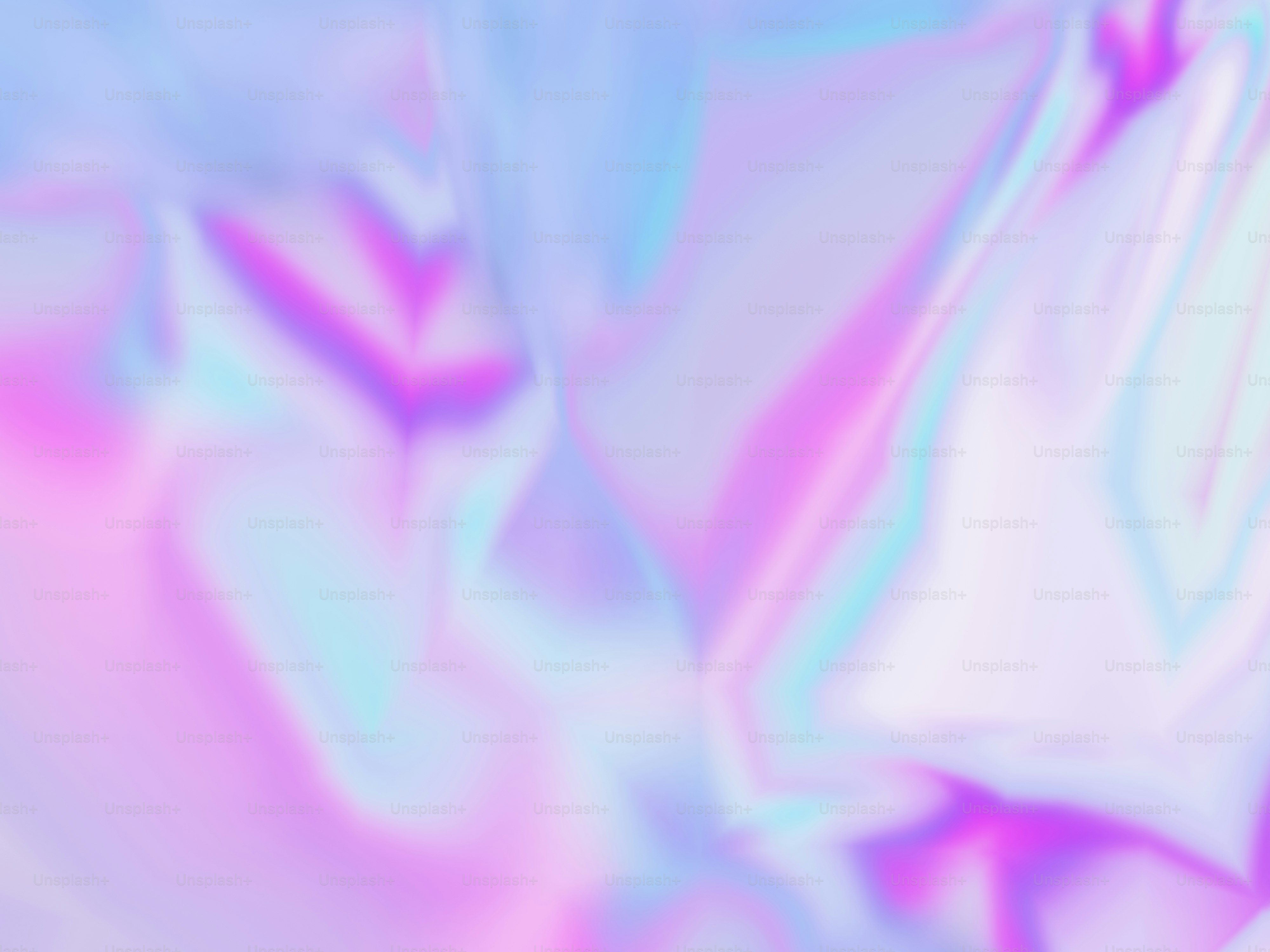 Ein verschwommenes Bild mit einem rosa und blauen Hintergrund