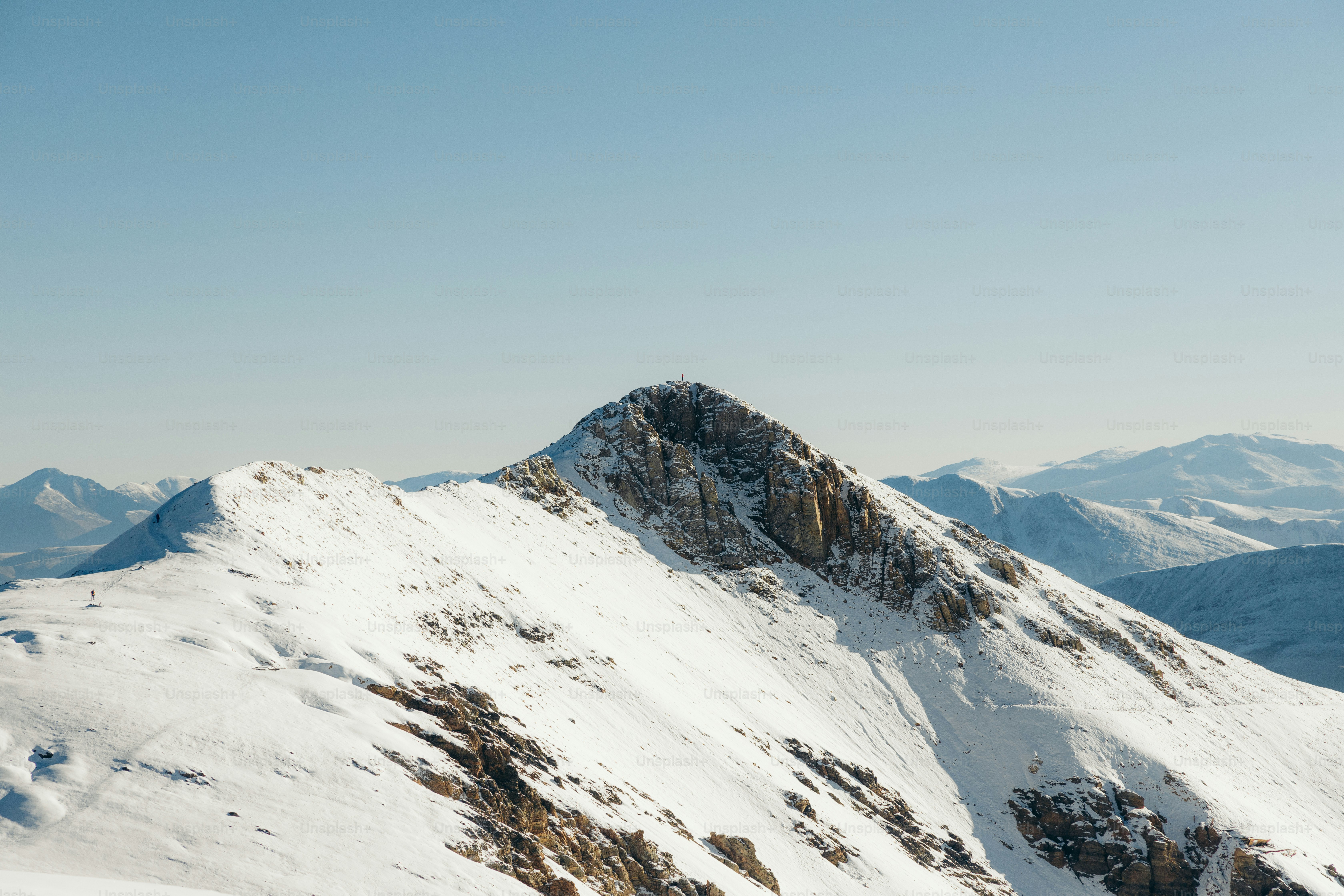 a snow covered mountain with a sky background