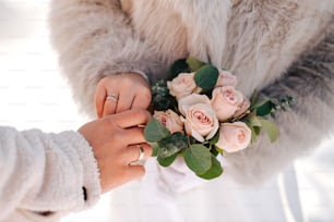 a couple of people that are holding flowers