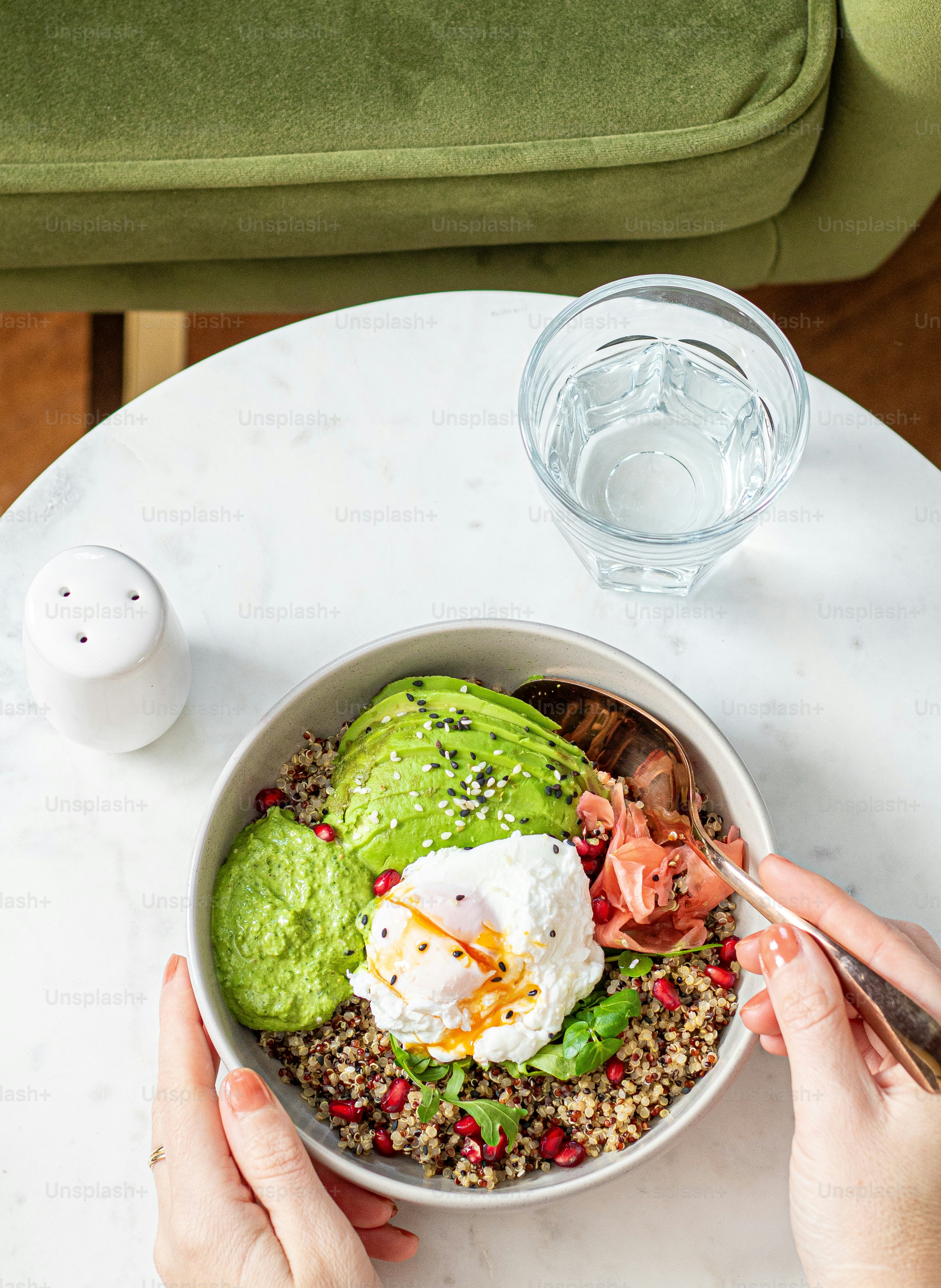 a person eating a bowl of food on a table