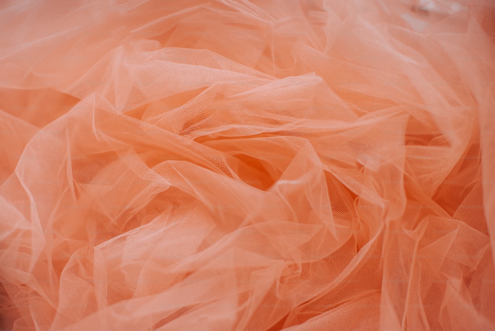 a close up of a piece of pink tulle