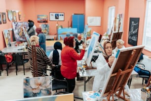 a group of people painting in a room