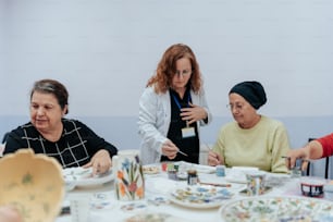 a group of women sitting around a table