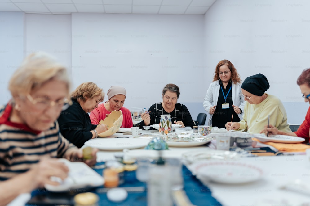 a group of people sitting around a table