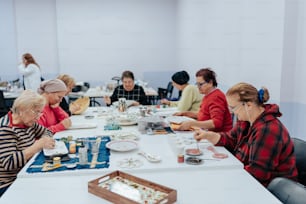 a group of people sitting at a table together