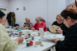 a group of women sitting at a table together