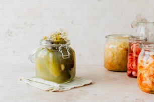 a group of jars filled with different types of food