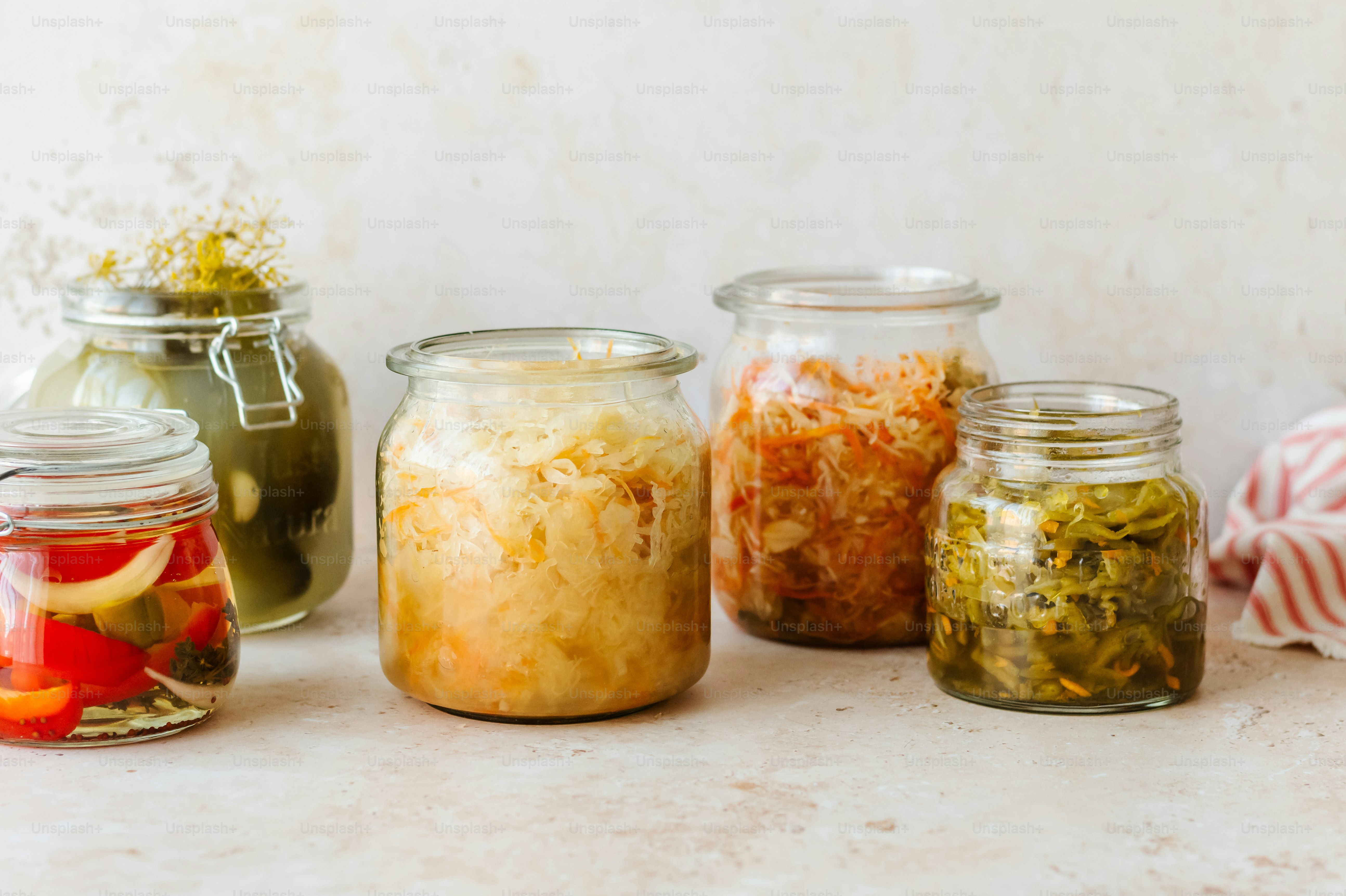 a group of jars filled with different types of food