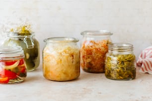 a group of jars filled with different types of food