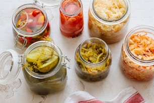 several jars filled with different types of food