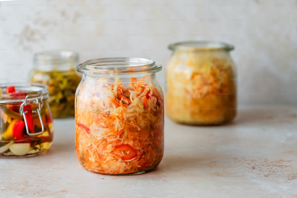 a group of jars filled with different types of food