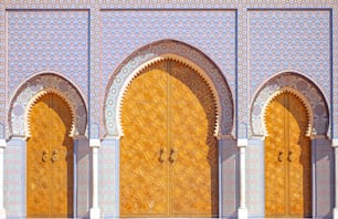 a couple of large wooden doors in front of a building