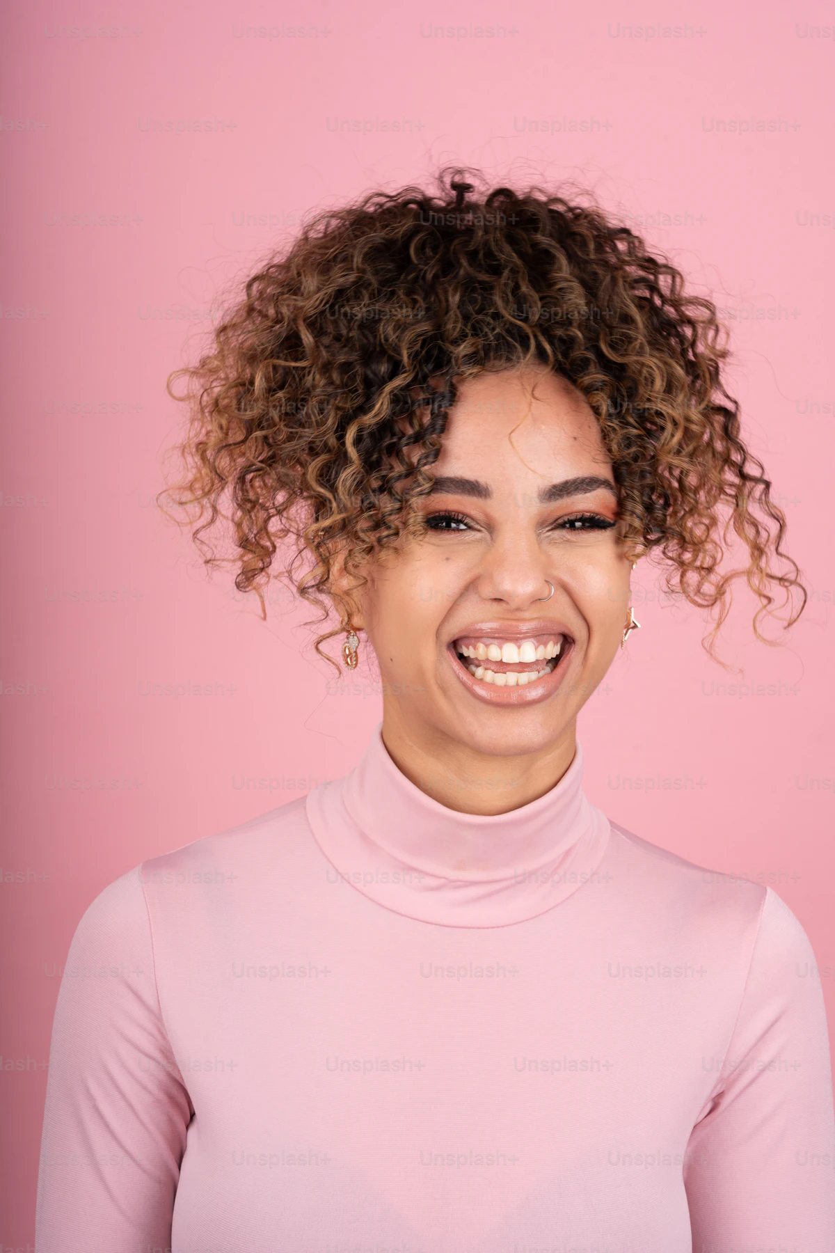 Laughing woman with natural curly hair