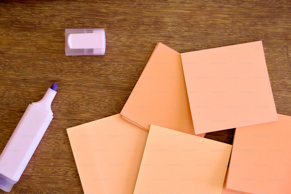 several pieces of paper and a marker on a table