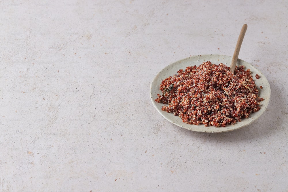 a bowl of food on a table with a spoon