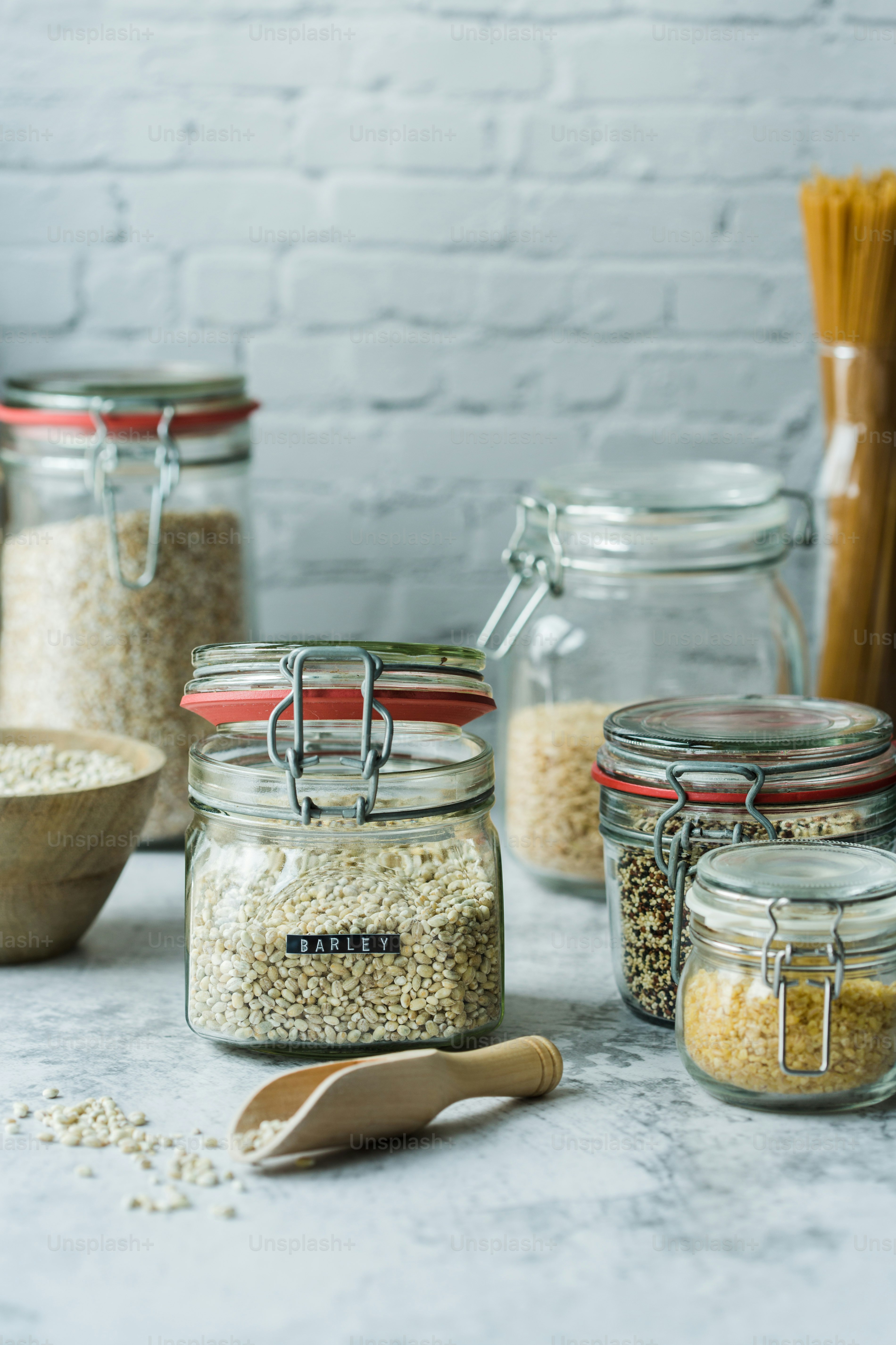a table topped with glass jars filled with food